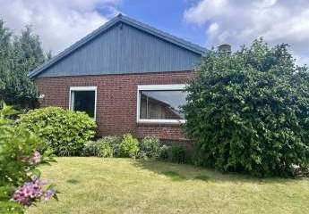 Wohnen auf einer Ebene in Lohe-Rickelshof: Bungalow mit Einliegerwohnung und Wintergarten