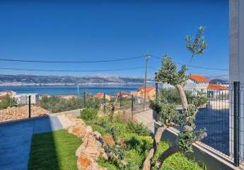 Erdgeschosswohnung mit Garten und Meerblick