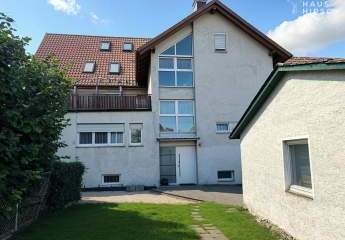 Großzügiges Mehrfamilienhaus mit Garten, Garagen & Gewerbebereich, ausgebauter Dachboden