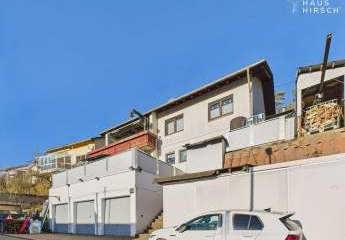 Einfamilienhaus mit Einliegerwohnung mit 3 Garagen, Panoramablick & Ausbaupotenzial im Dachgeschoss!