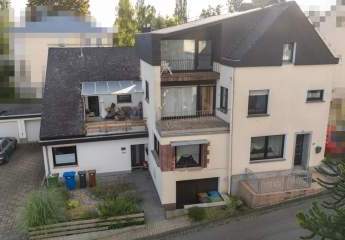 Zwei Häuser unter einem Dach – großzügiges Wohnhaus mit vermietetem Anbau, Garten, Doppelgarage