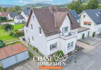 Charmante Doppelhaushälfte mit eigenem Garten und Garagen - Wohnen in TOP-Lage Lügdes!
