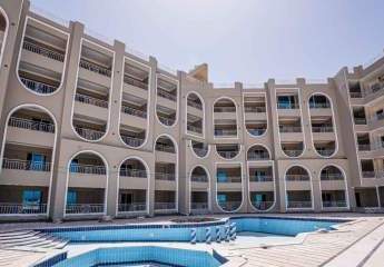 Stilvolle 1-Zimmer-Wohnung mit Meer- & Poolblick in Toplage