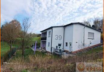 Einfamilienhaus mit Einliegerwohnung, Carport, Garage u. separatem Baugrundstück in Snt.- Mottgers.