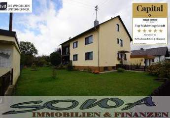 Schönes Zweifamilienhaus mit zwei Garagen aus einem großzügigen Grundstück - Ein Objekt von Ihrem Immobilienpartner SOWA Immobilien und Finanzen