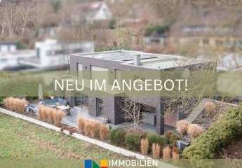 Architektenbungalow mit Split-Level-Bauweise, klarer Formensprache und freiem Landschaftsblick!