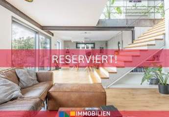 Architektenbungalow mit Split-Level-Bauweise, klarer Formensprache und freiem Landschaftsblick!