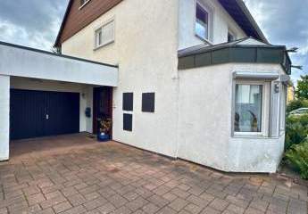 Einfamilienhaus mit Wintergarten, Garage + parkähnlichem Garten