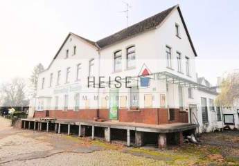 ** PREISREDUZIERUNG ** Wohn- und Geschäftshaus mit Gaststätte, Wohnung und Garagen in zentraler Lage